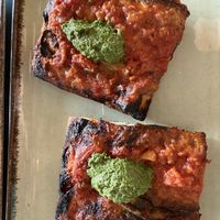 Tomatoes and pesto pizzaa  at MADENITALY in Copenhagen