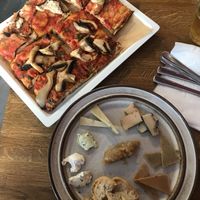 Eggplant pizza, mushroom pizza and cheese board  at MADENITALY in Copenhagen