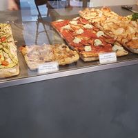 Pizza slices at MADENITALY in Copenhagen