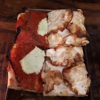 Eggplant and cashew cheese (left) and cauliflower cream and celeriac (right). Half slice of each  at MADENITALY in Copenhagen
