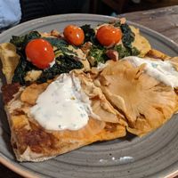 Hawaiian pizza (front) and chickpea cream pizza (back) at MADENITALY in Copenhagen