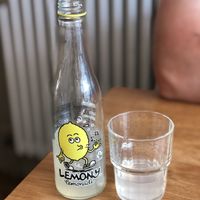 Cute bottle and tasted great, but very expensive. at Excalibur Cafe in Glastonbury