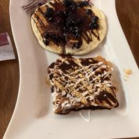 Blueberry pancake (top) and s’mores French toast   at The Purple Rooster Cafe in Attleboro