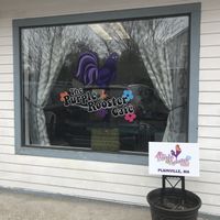 The front window at The Purple Rooster Cafe in Attleboro