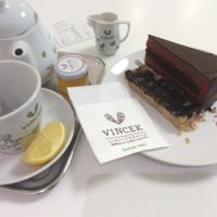 Chocolate and Raspberry cake with a cup of tea. at Vis a Vis Vincek Cake and Ice Cream in Zagreb