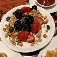 Vegan yogurt topped with granola and fruitt  at Disneyland - Storytellers Cafe in Anaheim