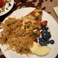 Hash browns, vegan omelette, and fresh fruit   at Disneyland - Storytellers Cafe in Anaheim