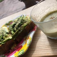 Matcha froth and avocado toast 🤤 at Under the Mango Tree in Miami Beach