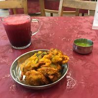 Healthy Heart Juice and a side of Pakoras at Thenga Cafe in London