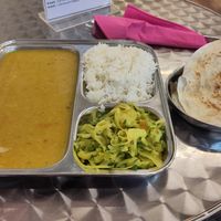 Daily lunch with a side paratha at Thenga Cafe in London