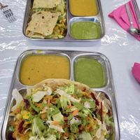 Puri Veg (bottom) and Stuffed Paratha (top) at Thenga Cafe in London