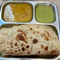 Stuffed paratha meal   at Thenga Cafe in London