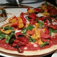 Gluten free pizza with  bell pepper, spinach and balsamic tomatoes at Zizzi - High St in Cardiff