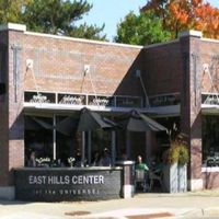 storefront - parking and a rain garden behind building at Marie Catrib's in Grand Rapids