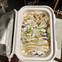 Seasoned red lentils over pasta— I selected onions, cashew cheese, & vegan sour cream as options at Umeke Market in Honolulu