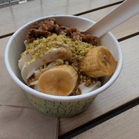 vanilla and coconut froyo, caramelised bananas, pistachio crumb, candied walnuts (pistachio Froyo and blondie underneath) at goje in Yarraville