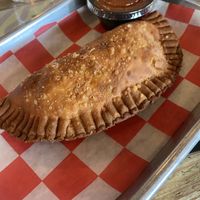Vegan Empanada - Eggplant, Zucchini, Squash, onions and tomatoes with spicy pique dipping sauce  at Johnny Tequilas in Roselle
