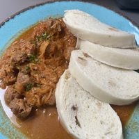 Goulash with dumplings  at Vegan's Prague in Prague