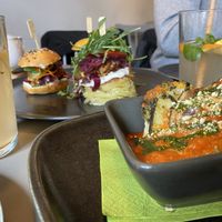 Homemade lemonade, selection of mini-burgers & zucchini lasagne 😋  at Vegan's Prague in Prague