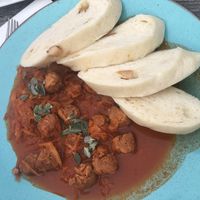 Tofu cabbage goulash with fluffy dumplings  at Vegan's Prague in Prague
