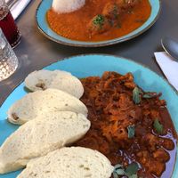 Far plate - quinoa balls in tomato sauce. Delicious sauce!!
Near plate - goulash with soya (I think) chunks and red cabbage and dumplings. Just yum! at Vegan's Prague in Prague