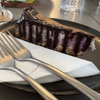 Poppyseed cheesecake with blueberry sauce  at Vegan's Prague in Prague