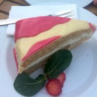 Raw apricot cake and marizpan 'Happy Cow' cake. This restaurant has exceptional desserts! at Vegan's Prague in Prague