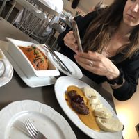 The lasagne and dumplings get thoroughly photographed !  at Vegan's Prague in Prague