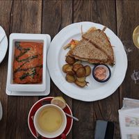 •Our sandwich with baked potatoes 
•Zucchini lasagna with spinach and parmesan  at Vegan's Prague in Prague