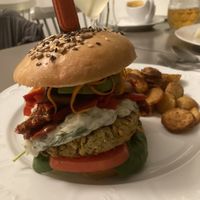 Chickpea basil burger with roast potatoes   at Vegan's Prague in Prague