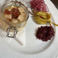 Cashew cheese with tofu and pickles and bread   at Vegan's Prague in Prague