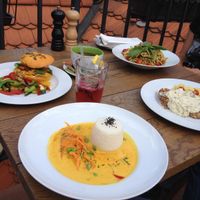 bugs bunny burger, coconut curry, daily offer (bean patty with mashed potatoes and mushroom sauce), zucchini pasta at Vegan's Prague in Prague