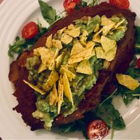 Baked sweet potato with avocado at Vegan's Prague in Prague