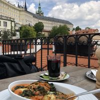 Zucchini lasagna and hot wine  at Vegan's Prague in Prague