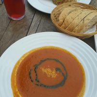 Soup of the day with avocado tartar and bread at Vegan's Prague in Prague