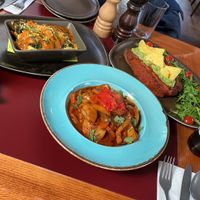 Eggplant lasagna, Potato Goulash and Sweet Potato with Guac at Vegan's Prague in Prague