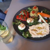 Mixed starter plate (suitable for 2 ppl) contains: Hummus, cucumber, guacamole, red pepper with pesto topping. And the homemade limo :-) at Vegan's Prague in Prague