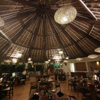Open restaurant cooled with ceiling fans by the sea at Salvia in Playa Del Carmen