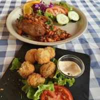 Breaded mushrooms & BBQ baked jacket potato with baked beans at O Forno in Calheta