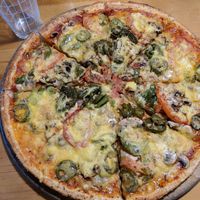 Pride with vegan cheese. at Hell Pizza in Queenstown