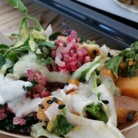salad with dressing  at Souls in Copenhagen