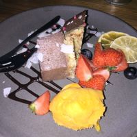 Raw delicious vegan chocolate cake with mango sorbet and dried fruits at Souls in Copenhagen