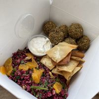 Go here!!!! Falafelbox with great sauce and chips. Super cheap and amazing food.  at FalafeLand in Santorini