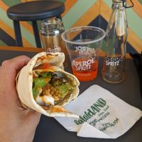 Volcano with added vegan mayo, aperol spritz, bio iced tea at FalafeLand in Santorini