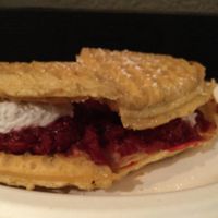 Vegan, low-sugar raspberry waffle sandwich with coconut whip at Smaaken Waffle Sandwiches - Food Truck in Portland