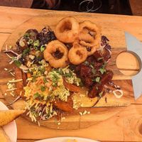 Onion rings, cauliflower wings, dirty sweet potato fries and bbq ribs at Voltaire in Bangor
