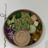 Ginger Peanut Bowl - ginger peanut sauce, organic kale, romaine, organic ginger tofu, broccoli, cucumber, avocado, cherry tomatoes, cabbage, cashews, scallions, basil, cilantro at Kupfert & Kim - Spadina in Toronto