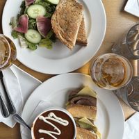 Turkey cranberry panini with garden salad; Cuban sandwich with black bean soup (soup of the day).   at Plant Matter Kitchen in London