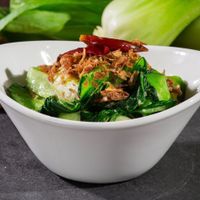 Bok choy stir-fried with garlic, dried chilies, and crunchy shallots at Yugo in Miami