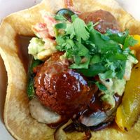 Down South: cilantro lime hummus, falafel balls, spicy enchilada sauce, peppers/onions, spicy guacamole on corn tortilla. 
Get thee in my mouth! Excellent eating hot, and just as good cold - great travel food. at Falacos - Food Truck in Houston